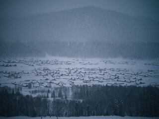 Fototapeta premium Serene Village in Snowy Night