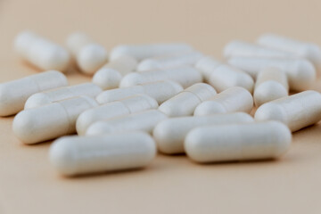 A stack of supplement capsules, dietary supplements, vitamin tablet, nutritional supplements in...