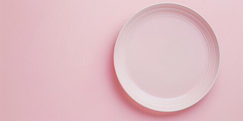 pink table surface with empty pink ceramic plate - obrazy, fototapety, plakaty