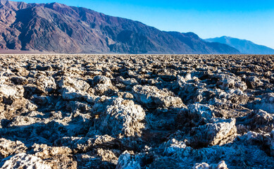 Self-sedimented salt cracked in the heat of the sun in the desert in Death Valley, Death Valley National Park, California