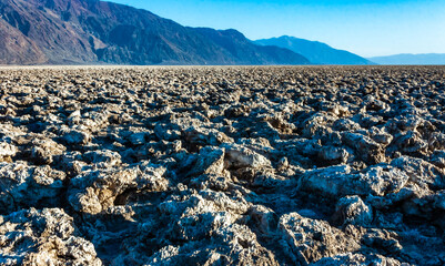 Self-sedimented salt cracked in the heat of the sun in the desert in Death Valley, Death Valley...