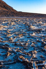 Salt plateau of self-sedimented salt cracked in the heat of the sun in the desert in Death Valley,...