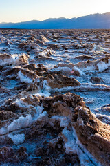 Salt plateau of self-sedimented salt cracked in the heat of the sun in the desert in Death Valley, Death Valley National Park, California