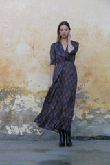 Female model in viscose casual brown patterned dress for fall season