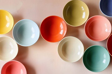 ceramic colored plates of different sizes on a light beige background