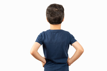 Young little caucasian kid wearing blue t-shirt standing over isolated white background standing backwards looking away
