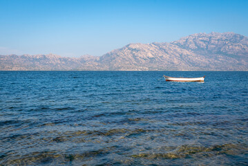 Small white boat at Bafa Lake. Mugla, Bodrum, Turkey