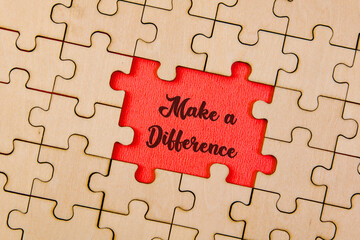 Piece missing from jigsaw puzzle with word Make a Difference