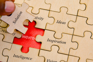 INNOVATION concept with jigsaw puzzle pieces business solution and success concept