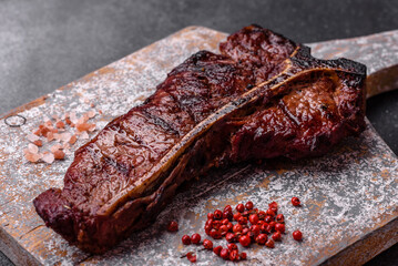 Delicious juicy beef tbone steak with salt, spices and herbs