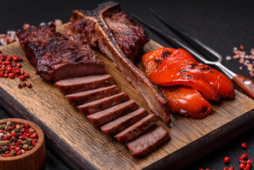Delicious juicy beef tbone steak with salt, spices and herbs