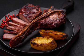 Delicious juicy beef tbone steak with salt, spices and herbs
