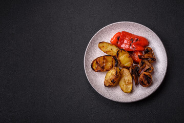 Delicious juicy grilled vegetables potatoes, tomatoes, peppers, eggplant