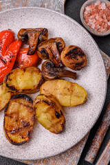 Delicious juicy grilled vegetables potatoes, tomatoes, peppers, eggplant