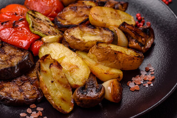 Delicious juicy grilled vegetables potatoes, tomatoes, peppers, eggplant