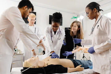 Medical personnel demonstrating cpr on dummy