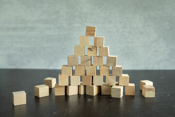 Stack of blank wooden cubes stacked in a pyramid shape