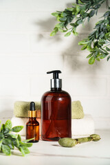 Beauty products in the bathroom on white background. Soap, serum bottle, jade roller. Skin care. - 783349997