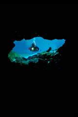 Scuba diver entering a cave at Rainbow River Springs, Florida