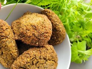 Vegetarian portion of homemade burgers and plant decoration.