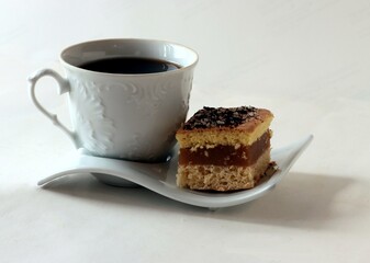 espresso coffee and coffee maker and cake close up