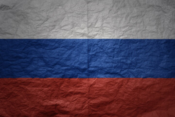 big national flag of russia on a grunge old paper texture background