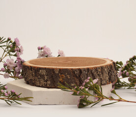 Wood circle stump, flower platform podium on beige background. Minimal empty display product presentation scene.