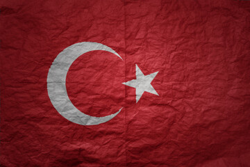 big national flag of turkey on a grunge old paper texture background
