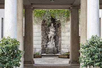 The original statue of Neptune in the courtyard of Trento town hall at Thun Palace. Trentino-Alto Adige, Italy © cabuscaa