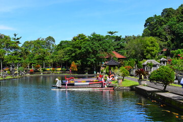 BALI ISLAND - INDONESIA  18.06.2022: Hindu Balinese Water Palace Tirta Gangga with statues of the...