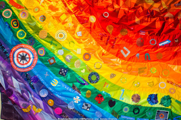 Art Celebrating LGBTQ+ Resilience and Gender Diversity with Vibrant Tapestry
