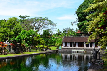 BALI ISLAND - INDONESIA  18.06.2022: Hindu Balinese Water Palace Tirta Gangga with statues of the...