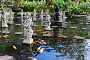 BALI ISLAND - INDONESIA  18.06.2022: Hindu Balinese Water Palace Tirta Gangga with statues of the...