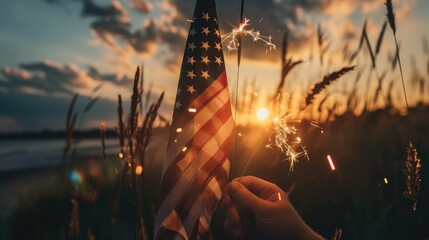 Happy 4th of July Independence Day. Hands holding sparklers celebration with American flag at sunset nature background, soft focus. Concept Independence,Memorial,Veterans