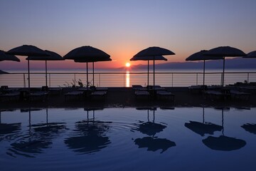 fabulous sunrise by the pool by the sea