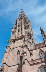 Fototapeta na wymiar The church tower of Freiburg Minster on a sunny day, Germany