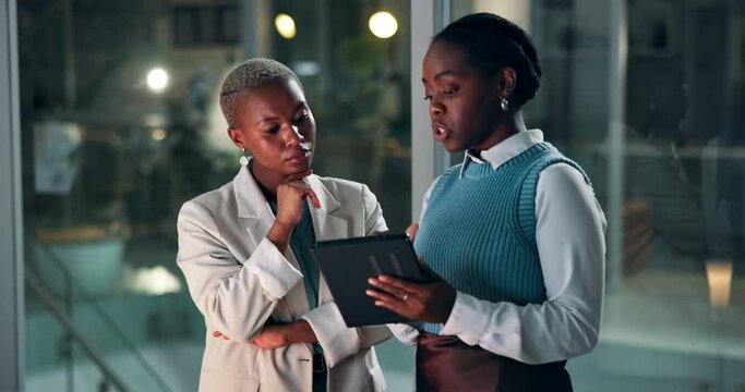 Black women, business or tablet at night in office, collaboration or online research for creative project. African people, journalist or teamwork for editing a article or brainstorming on touchscreen