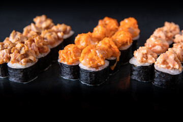Sushi beautifully presented on a black table, culinary concept, stock photo