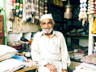 Portrait of a unknowns Nepali people selling souvenirs at the street market in Kathmandu in the afternoon