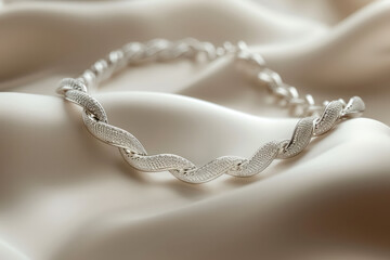 elegant silver bracelet on soft white fabric, perfect for a touch of luxury and sophistication