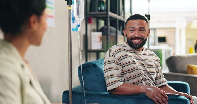 Hospital, IV drip and people in chemotherapy talking, in conversation and chat together for support. Healthcare, clinic and man and woman with liquid for cancer treatment, medicine and medication