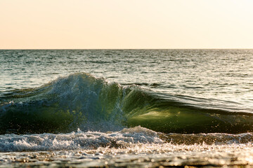 Small powerful wave breaking at the shore - 1