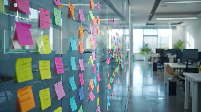 large board with colorful sticky notes hanging brainstorming and project planning office interior stock photo