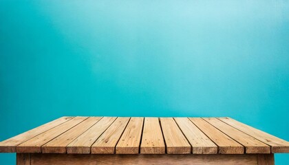 empty wooden deck table over light blue wallpaper background for present product