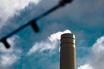 Smoke stack at Battersea Power Station releasing gas into the sky