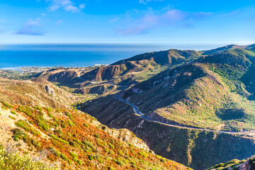 Aerial view of Malibu Canyon road. Malibu Canyon Road is a two-lane scenic route that connects US 101 near Calabasas to SR-1 in Malibu, California - 783403904