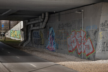 graffiti on the wall under the bridge