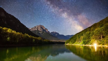 Gardinen beautiful view of milky way glowing on the sky with mountains and river and reflections of stars © Mac