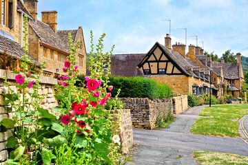 Beautiful Cotswolds village of Broadway with flowers, Gloucestershire, England