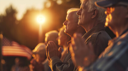 A poignant scene of veterans placing their hands over their hearts as the national anthem plays, gathered around a flagpole. The setting sun casts a soft glow, enhancing the emotio
